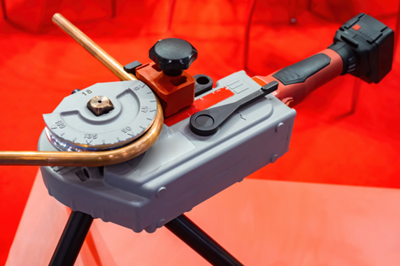 Simple mechanical tube bending tool with a small motor